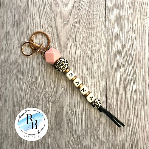 Beaded leopard pink white and gold keychain with tassel